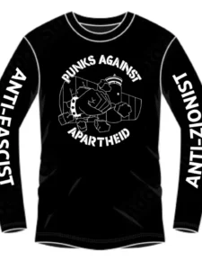 Slide 5: A black T-shirt design which is long sleeve, showing the circular punks against apartheid logo with the fist wearing a spikey bracelet punching through the apartheid wall surrounded by the stenciled text PUNKS AGAINST APARTHEID and the words ANTI-ZIONIST and ANTI-FASCIST on the right and left sleeves respectively.